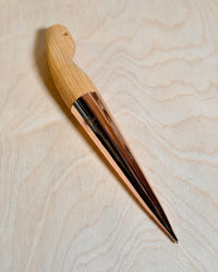 copper dibber for planting on birch ply background