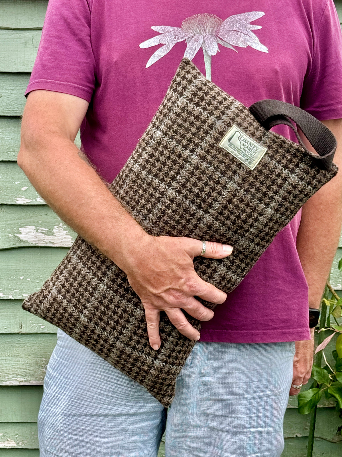 Man holding wool garden kneeler cushion
